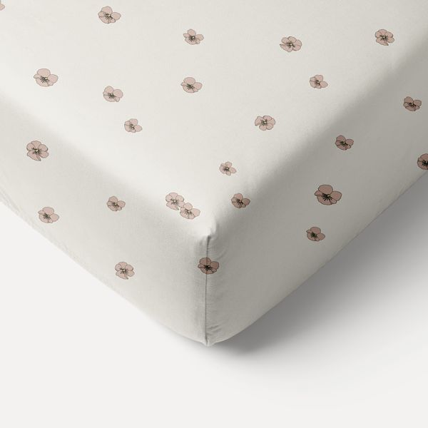 Fitted sheet in 90x200 cm in dusty pink and yellow from cotton with violets from Petite Amélie 